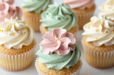 A cozy kitchen counter with fresh cupcakes and a handwritten note inviting contact.