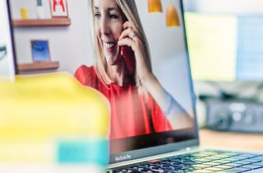 Catherine Aygen on the phone and on a Zoom call