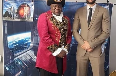Braxton Vanzant, as Marcus Garvey Heru, poses with Rashad Singleton, National Reparations League