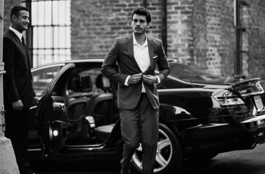 Man stepping down of a Mercedes-Benz S-Class