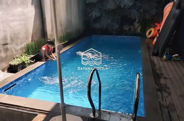 kolam renang dengan finising batu alam di bekasi