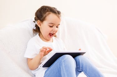 Girl using a tablet under parental control
