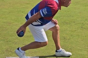 A porthcawl bowls club player in the process of releasing his bowl