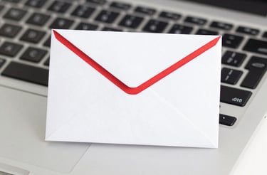 A cozy workspace with a laptop, a cup of coffee, and a copy of the book about AI in Brazilian judicial decisions.