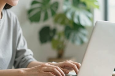 A cozy workspace with a laptop, notebook, and a cup of tea inviting communication