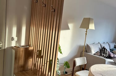 a living room with a table and chairs