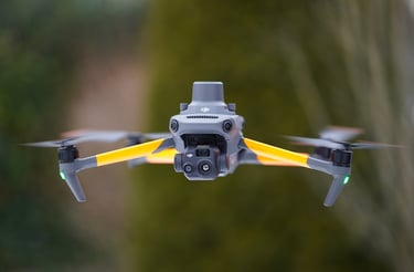 Professional DJI Mavic 3 Enterprise drone with RTK module hovering outdoors against a blurred forest background.
