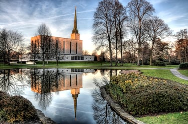 London Temple reflected in water.