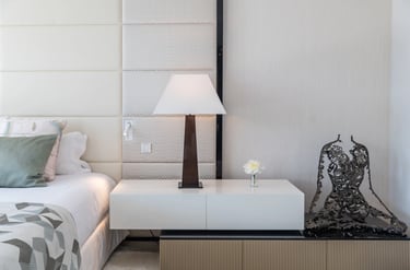 Villa Serenity bedroom with white headboard and soft neutral tones