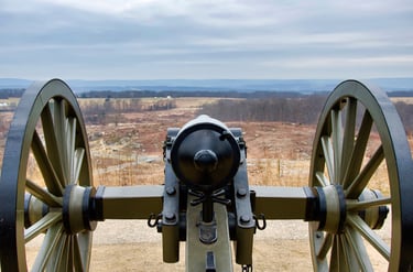 Historic Civil War cannon on Little Round Top overlooking the Gettysburg National Military Park battlefield.