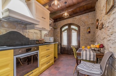 Stone walls of modern kitchen in Villa Galanoussa