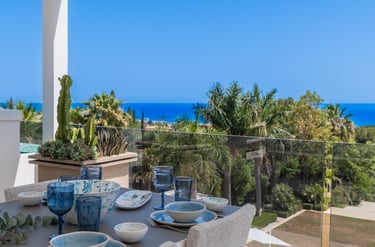 Rooftop dining area with sea views at Villa Serenity