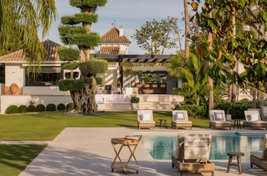 Main pool and sculpted olive tree garden at Villa El Olivo, Marbella