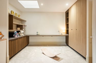 a room with a wooden floor and a wooden desk