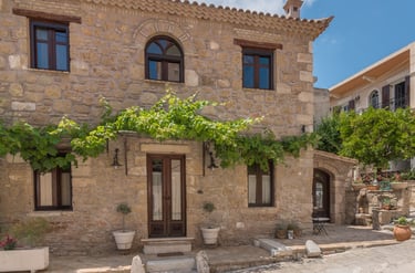 Authentic 1900s stone exterior of Villa Galanoussa in Zante Town, showcasing traditional Zakynthian architecture.