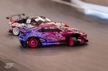 a pink and blue RC car drifting