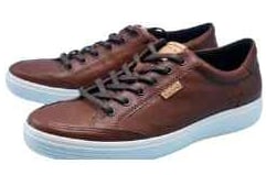 a brown leather sneaker with a white sole and a brown leather upper part of
