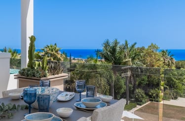 Rooftop dining area with sea views at Villa Serenity