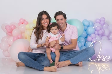 a baby boy in a circus themed birthday party