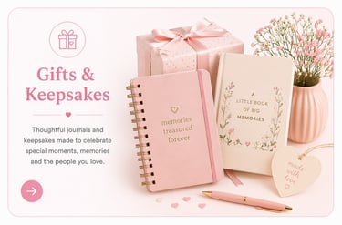 Pink memory journals and personalized gifts with a wrapped present and floral decorations for keepsakes.