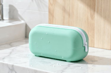 The "PureForm" GWP ecosystem in mint green **silicone**, including a pouch, bowl, and bottle