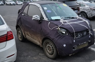 Smart #2 elétrico 2026 protótipo camuflado visto de frente lateral destacando novo modelo