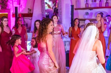 a bride and groomsmid dancing at a wedding