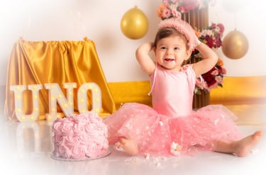 a little girl in a purple dress sitting on a couch