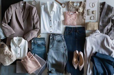 a bunch of clothes and accessories on a table