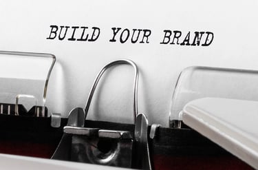 Typewriter with 'BUILD YOUR BRAND' on the paper
