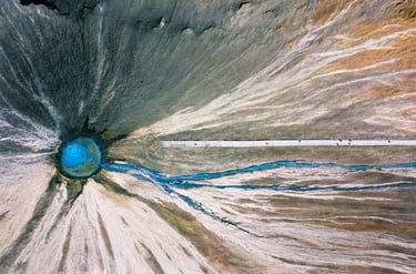 a large blue hole in the middle of a large hole . arbab naimat kasi , balochistan , Chandragup