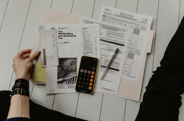 Tax papers with a calculator and pen