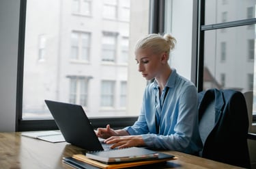 Young lady sitting in front of laptop