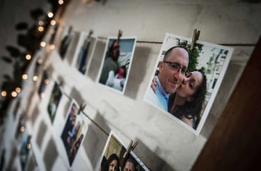 polaroid pictures hanging on wall