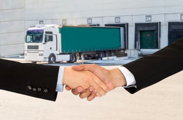 Handshake in front of Truck
