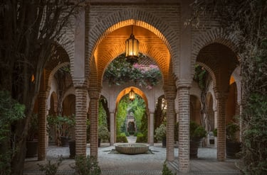 Lantern-lit Moorish colonnade with tiled floor and inner fountain