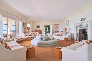 Spacious living room with fireplace and ocean views