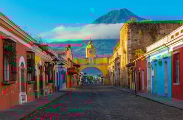 Santa Catalina Arch in Antigua Guatemala with Agua Volcano in the background.