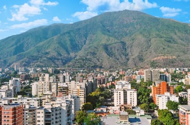 Panoramic view of Caracas city skyline with high-rise buildings and El Avila mountain in Venezuela.