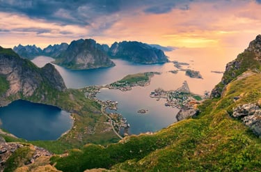 Panoramic sunset view of Reine village and fjords in Lofoten Islands, Norway from Reinebringen mountain.