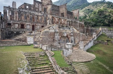 Historic stone ruins of Sans-Souci Palace with grand staircases in Milot, Haiti.