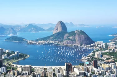 Panoramic aerial view of Sugarloaf Mountain and Botafogo Bay with boats in Rio de Janeiro, Brazil.