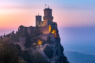 Guaita Tower castle on Mount Titano in San Marino at sunset with panoramic views.