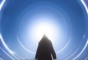 a person standing in front of a portal