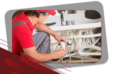 a man in a red shirt is holding a remote control system
