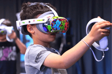 A boy in a vr headset with a video game controller