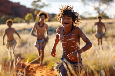 Happy young Australian Aboriginal children running and playing in the bush