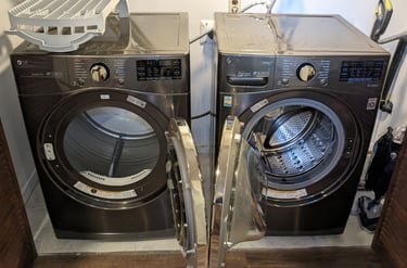 LG Dryer on the left, LG washer on the right both doors are open