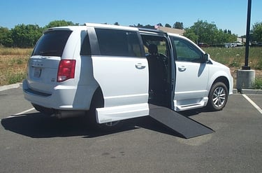Side view of 2019 Dodge Grand Caravan SXT with the VMI In-Floor Ramp being Deployed