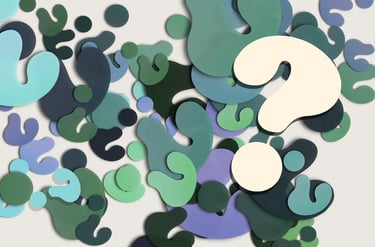 multitude de points d'interrogation dans coloris blanc, bleu, vert, noir